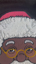 Load and play video in Gallery viewer, The Black Santa Experience Sweatshirt
